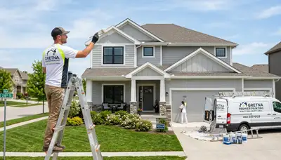 Professional house painters enhancing home exterior in Omaha, NE
