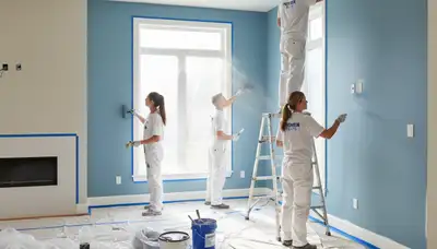 Professional interior house painters in Omaha, NE applying smooth finish for lasting home color